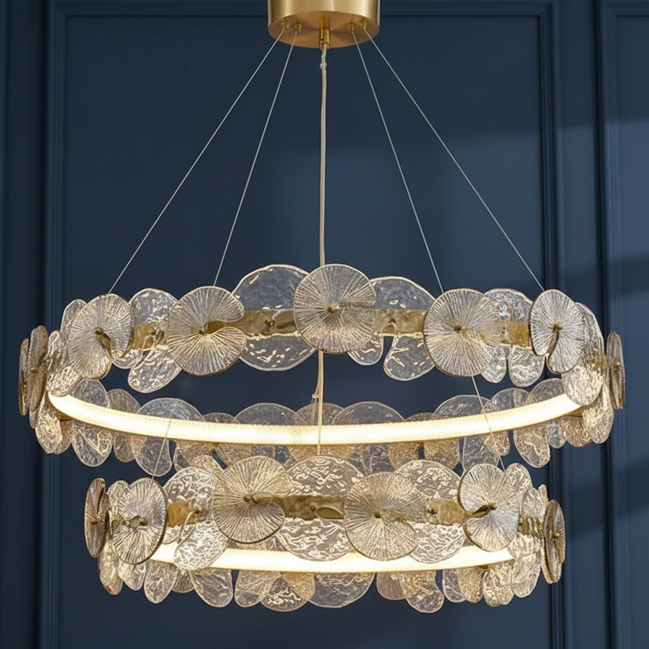 Gold-tone hanging chandelier with layered petal discs and circular ribbed ring shade