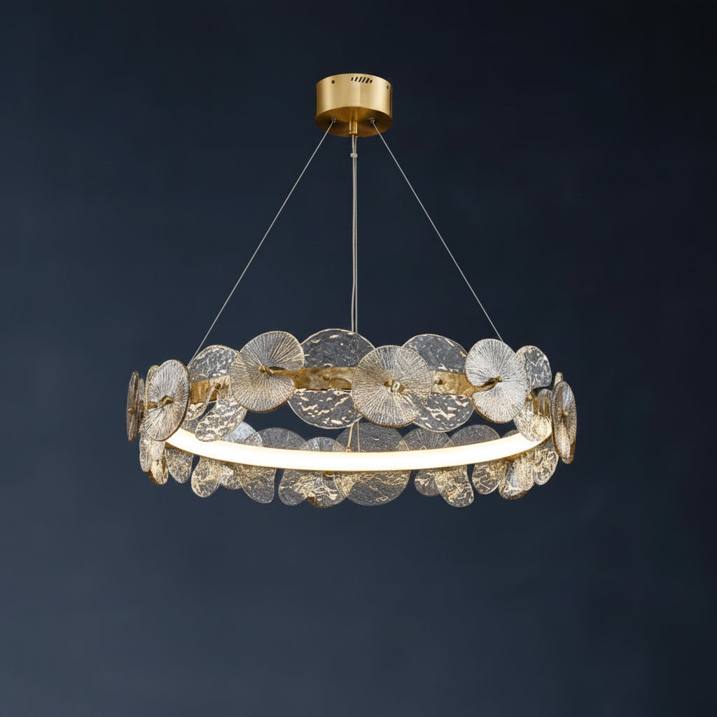 Gold-tone circular ribbed chandelier with layered petal disc elements and glowing ring