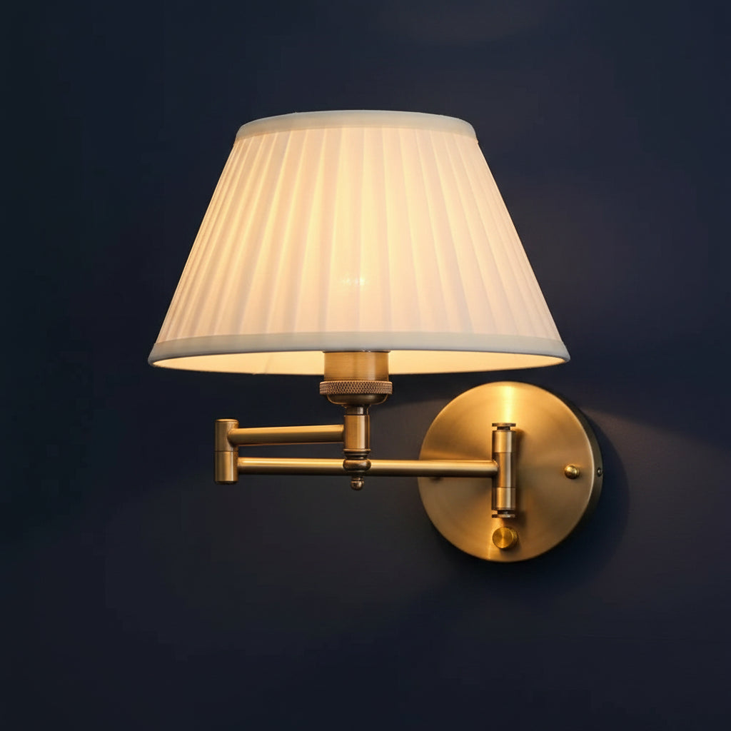 Brass wall sconce lamp with fabric drum shade and adjustable swing arm