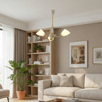 Angled cone chandelier with white canopy, gold arms, and three white cone shades