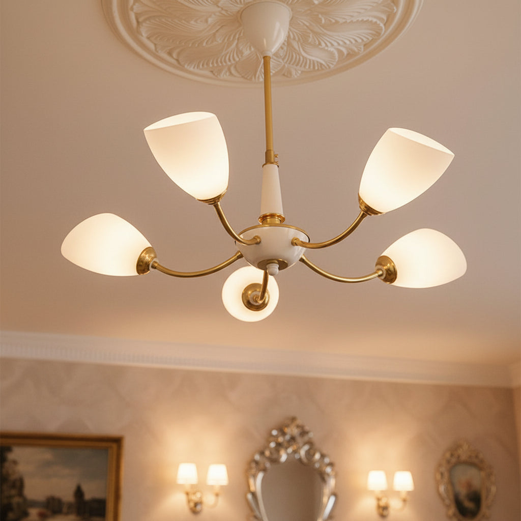 Angled cone chandelier with gold arms and five white angled cone shades