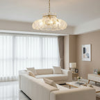Ripple-textured glass petal chandelier shade with scalloped rim, warm light glow.