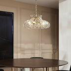 Ripple scalloped glass hanging chandelier with multiple petal shades on chain.