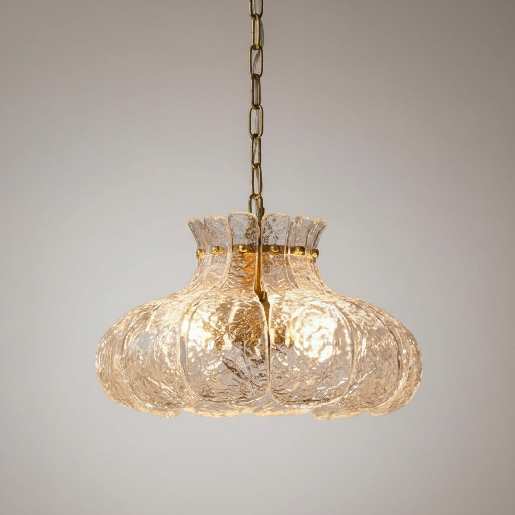 Close view of ripple-textured glass petal chandelier shade with scalloped edge detail.