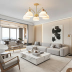 5-light multi-arm chandelier with ribbed white glass shades, gold arms, and wood accents