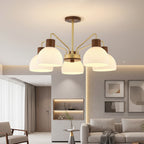5-light branch chandelier with ribbed white glass shades, gold arms, and wood-toned caps