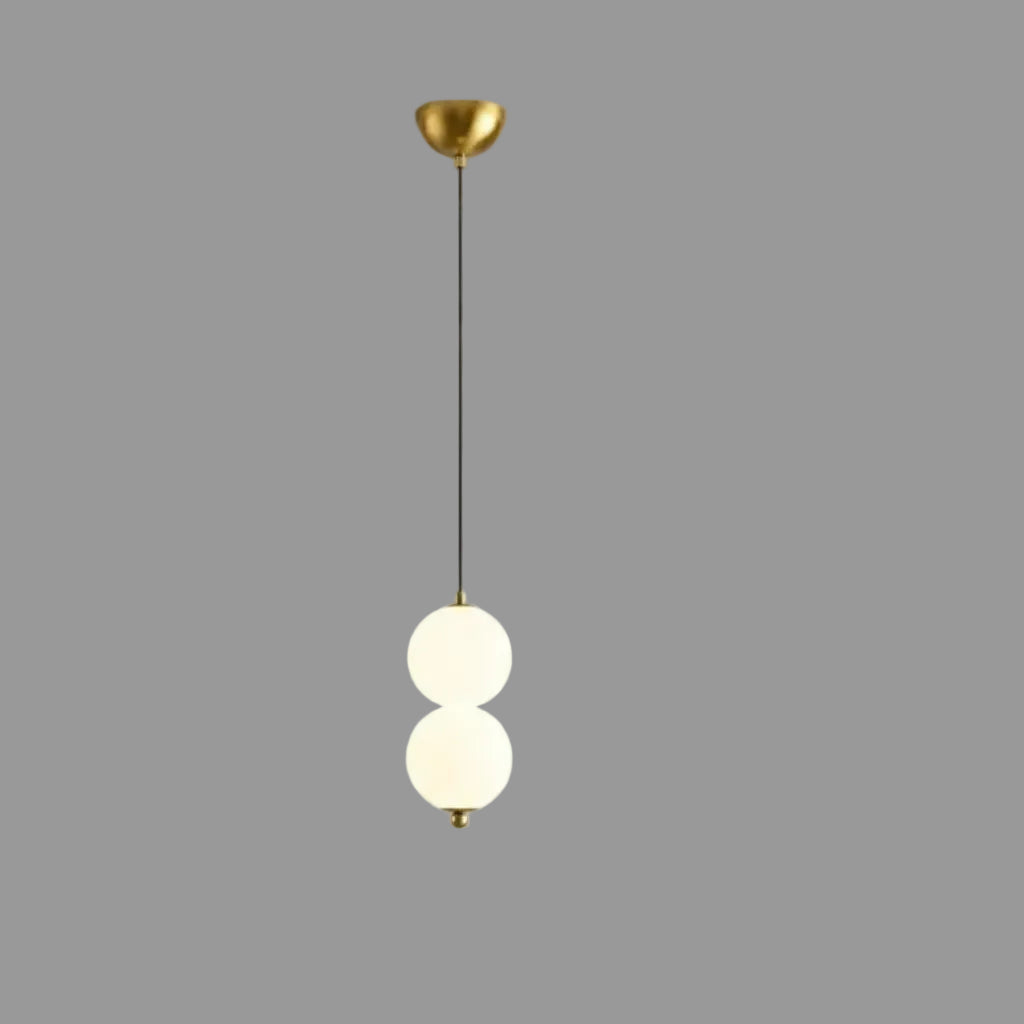 Stacked globe pendant light with two opal glass shades, gold canopy and dark cord
