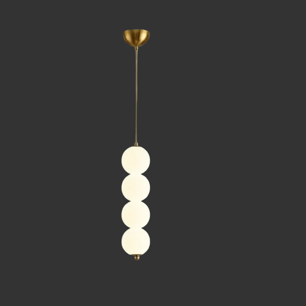 Stacked globe pendant light with four opal glass shades, gold canopy and stem
