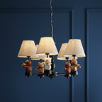 Black conical multi-arm hanging chandelier with fabric shades and cat figurines