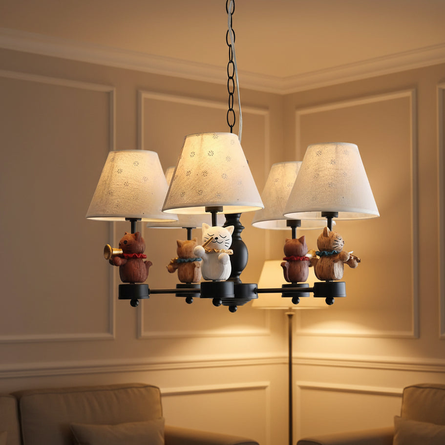 Black conical chandelier with three fabric shades and cat figurines