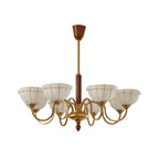 Gold 5-light chandelier with curved arms and five off-white glass shades