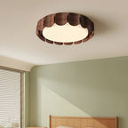 Ceiling light with circular scalloped wood rim and soft white light panel