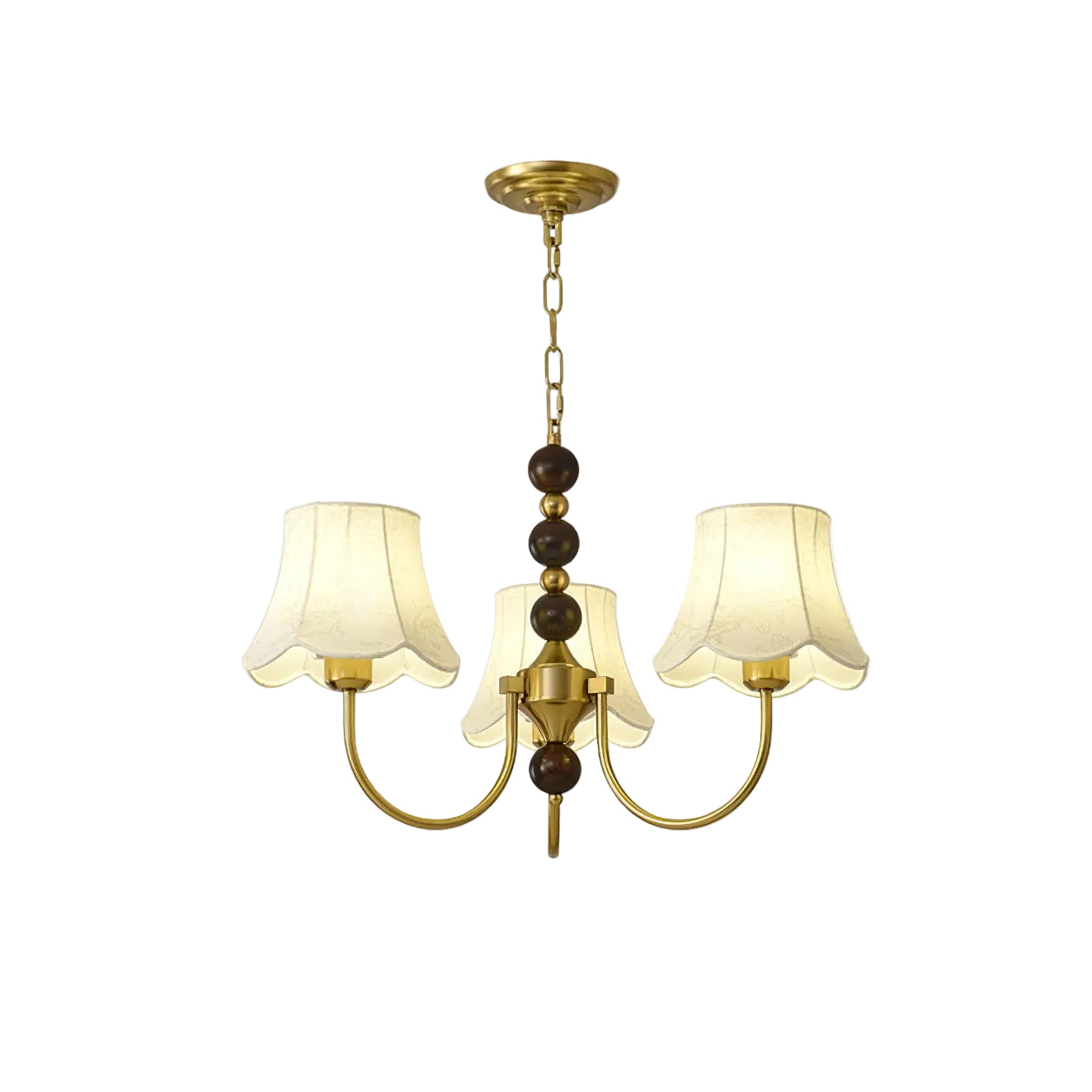 Three-light gold chandelier with chain detail and cream scalloped fabric shades