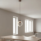 Circular halo hanging pendant light with travertine ring and bronze center diffuser
