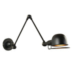 Black swing arm wall light with round base and dome shade