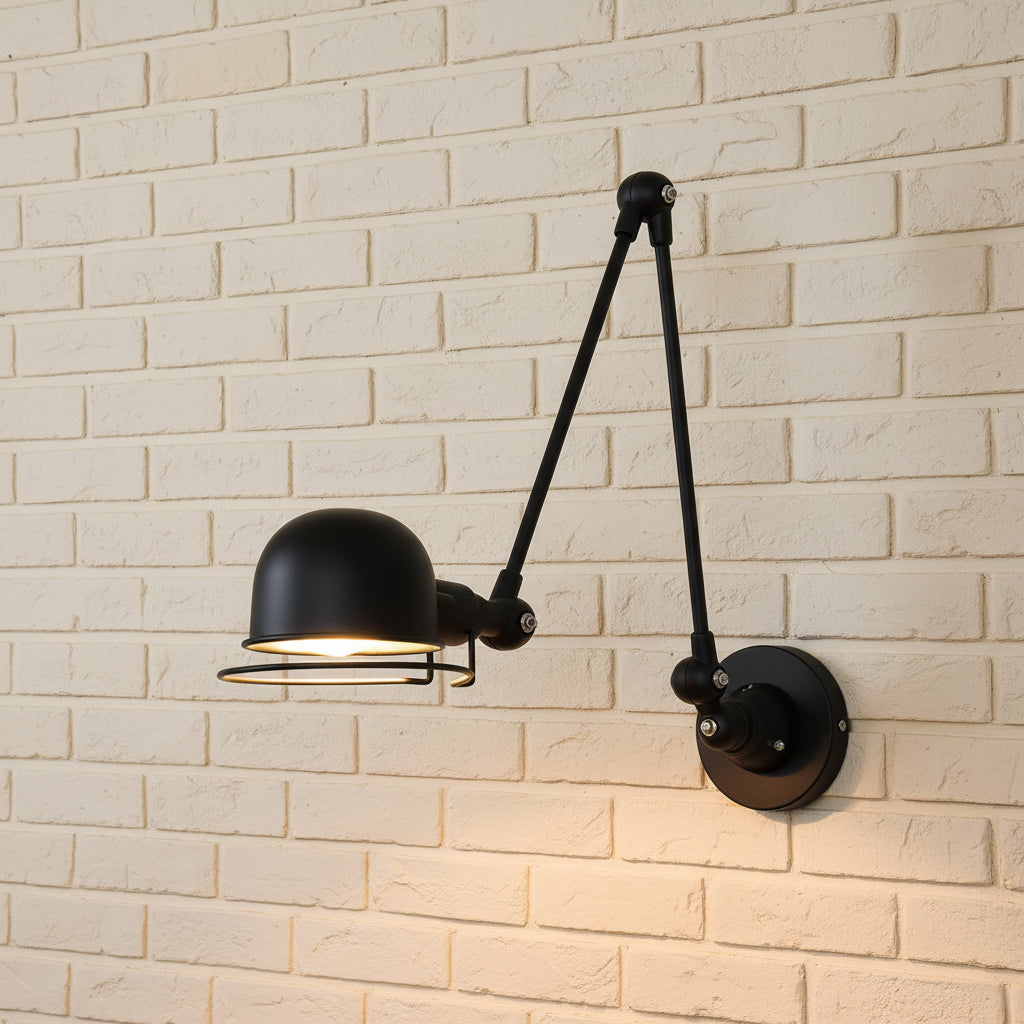 Black swing arm wall light with dome shade and adjustable arm