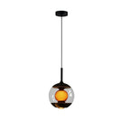 Hourglass globe pendant light with black stem, round canopy, clear glass, warm amber core