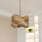 Light wood ribbon pendant lamp with sculpted overlapping shades and black hanging cord.