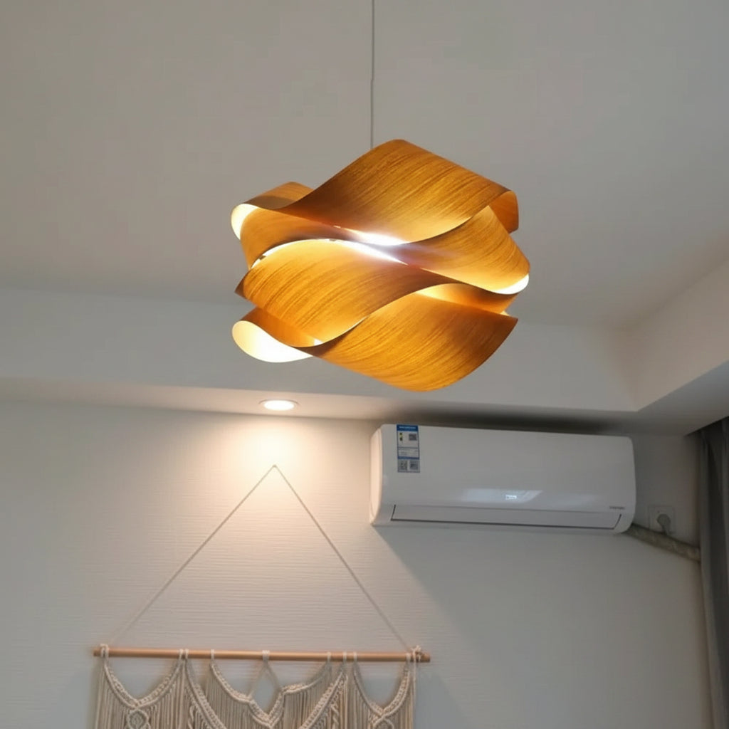 Wood pendant lamp with overlapping ribbon shades emitting warm light, black cord.