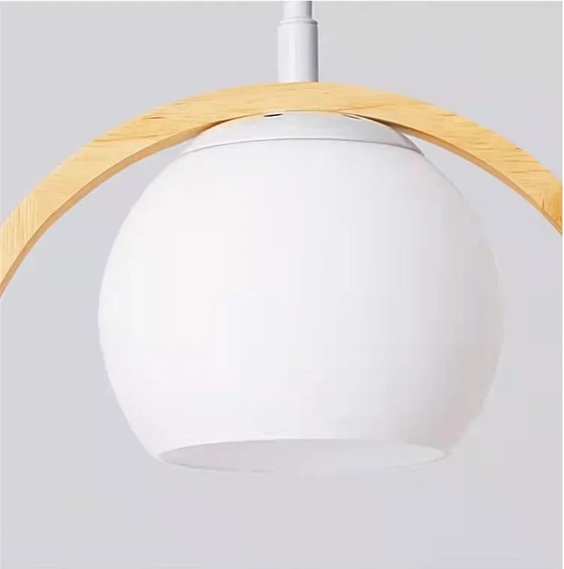 Wood halo bird wall light with frosted glass dome and round wooden ring