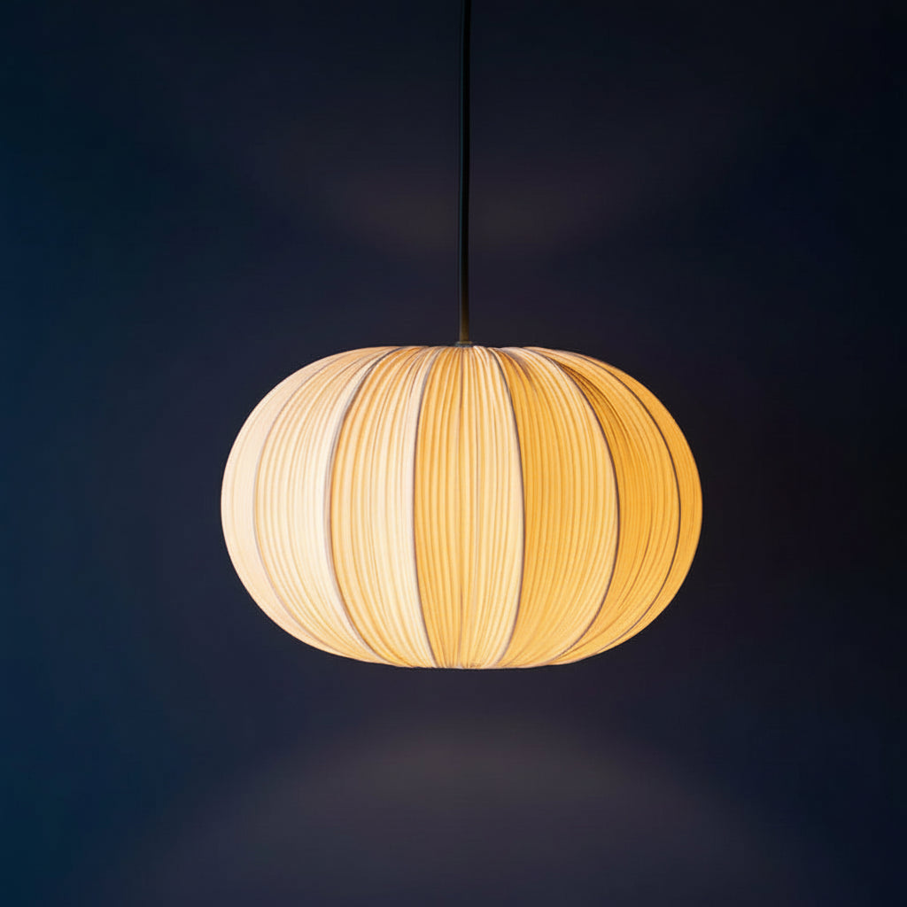 Fabric pumpkin pendant light with warm tan pleated fabric shade and hanging cord