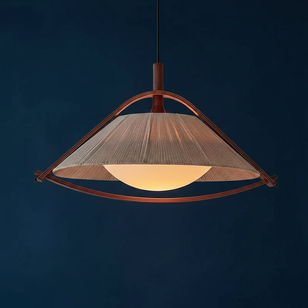 Textile conical pendant light with bronze ring frame and warm lit diffuser