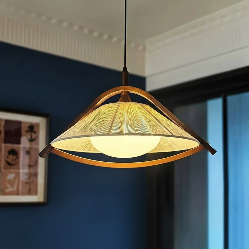 Textile conical pendant light with bronze frame, ribbed shade and warm glow
