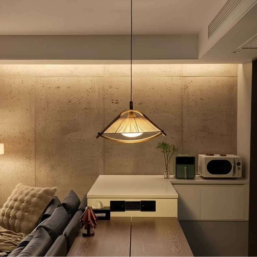 Conical fabric pendant light with bronze frame and warm glow