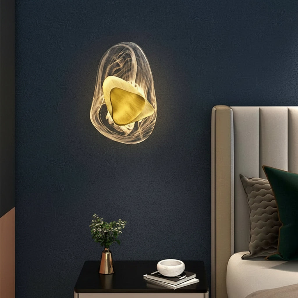 Layered egg wall light with translucent outer shell and gold inner shade, warm glow.