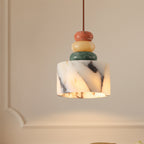 Marble-look pendant light with stacked pebble beads in terracotta, cream, and green