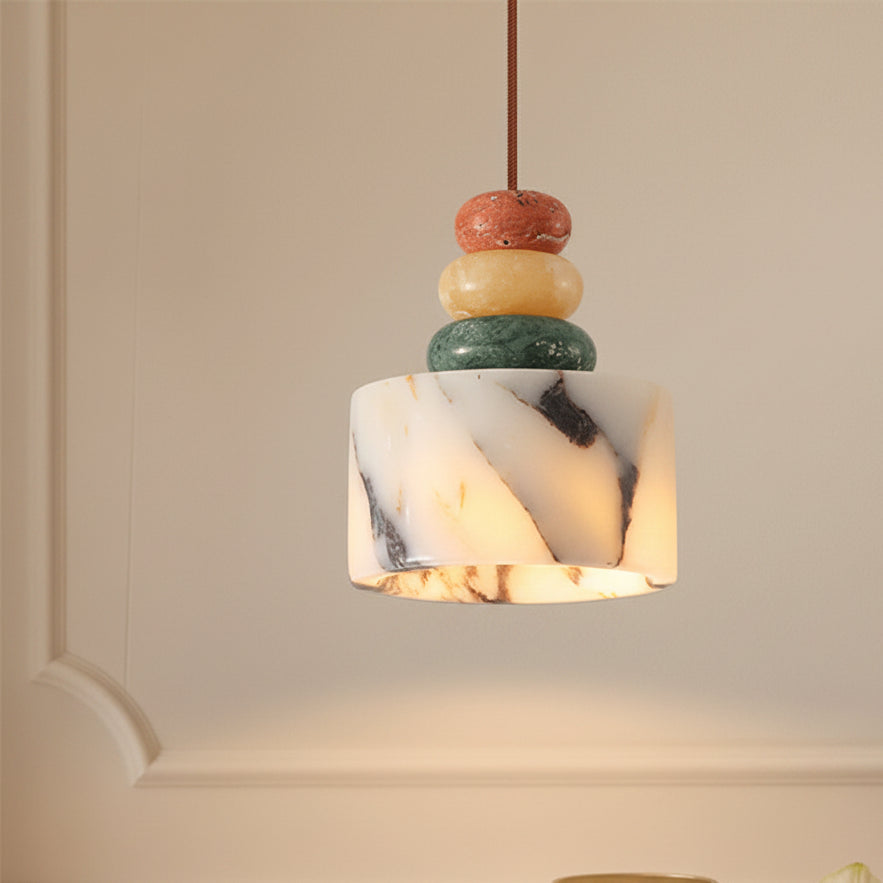 Marble-look pendant light with stacked pebble beads in terracotta, cream, and green