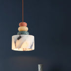 Marble-style pendant light with terracotta, cream, and green stacked beads