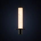 Long tube pendant light with translucent alabaster shade and black base