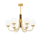 Gold and dark brown multi-globe chandelier with round glass shades and curved brass arms
