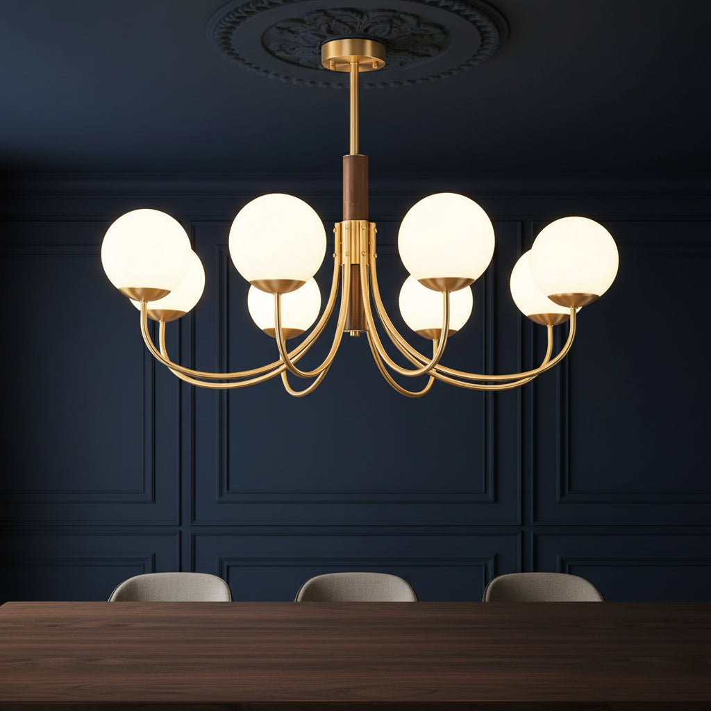Gold and dark brown chandelier with several round glass globe bulbs on curved metal arms