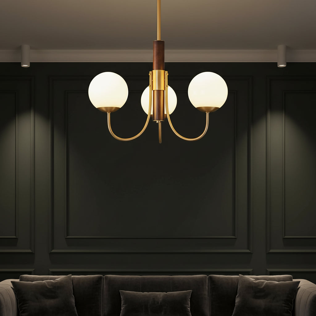 Gold globe chandelier with dark brown vertical stem and multiple round glass bulb shades