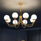 Gold and dark brown ceiling-hung globe chandelier with multiple round glass bulb shades