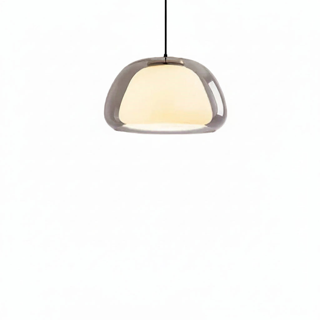 Nordic tinted glass pendant light with smoky gray shade and warm glowing diffuser