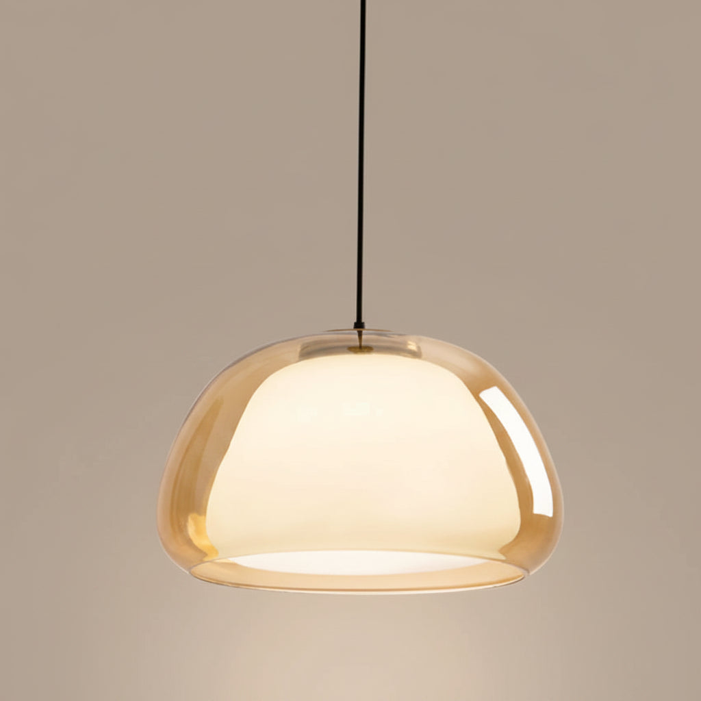 Nordic tinted glass pendant light with amber tinted glass shade and warm glow