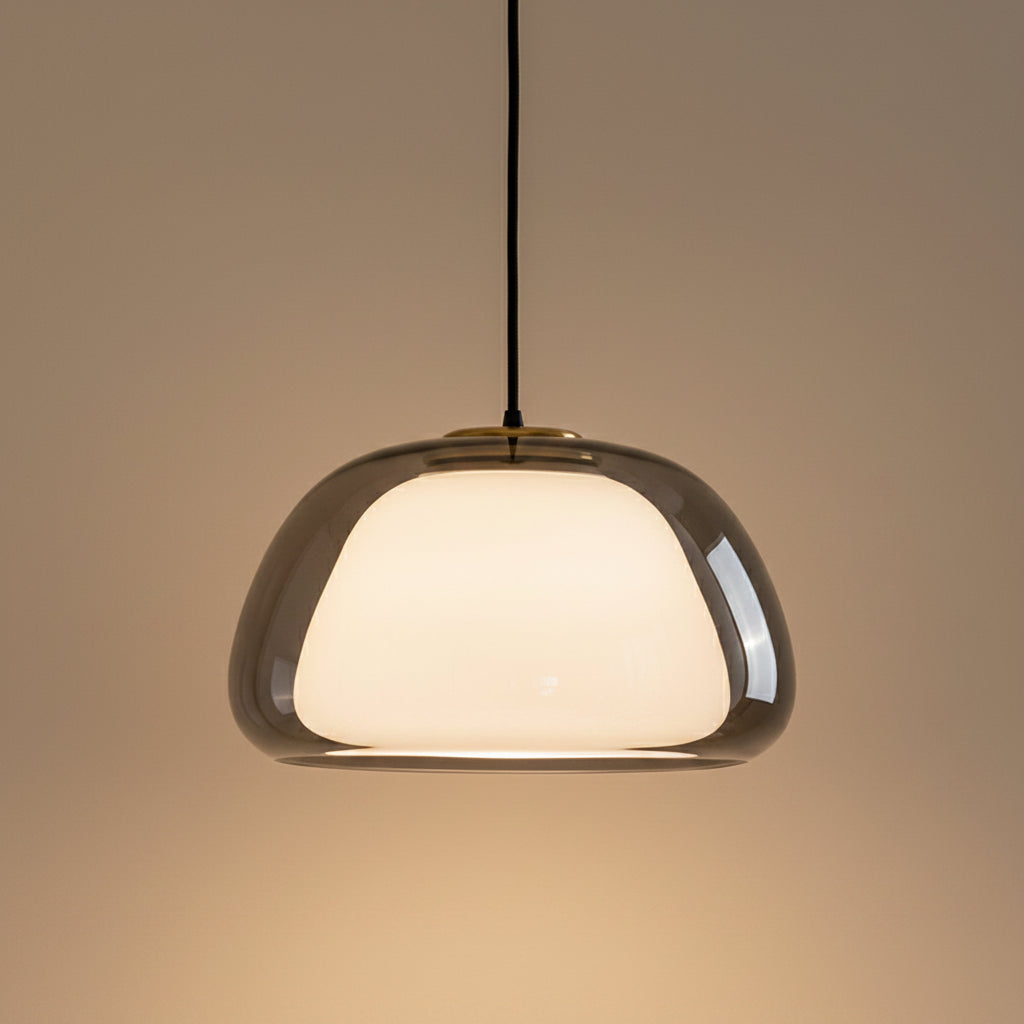 Nordic tinted glass pendant light with dark gray tinted glass shade and warm glow