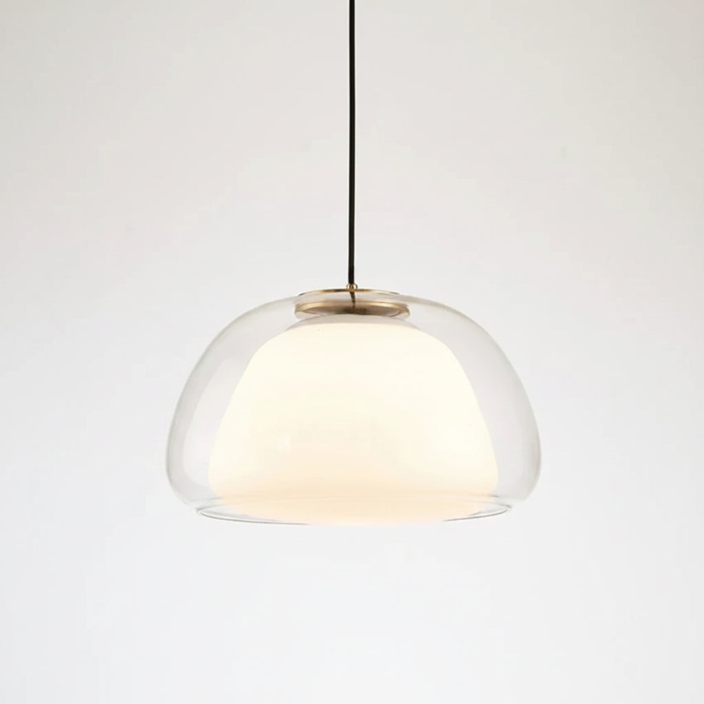 Nordic tinted glass pendant light with clear glass dome shade and warm glow