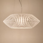 White diamond tapered hanging chandelier with open geometric lattice and glowing bulb