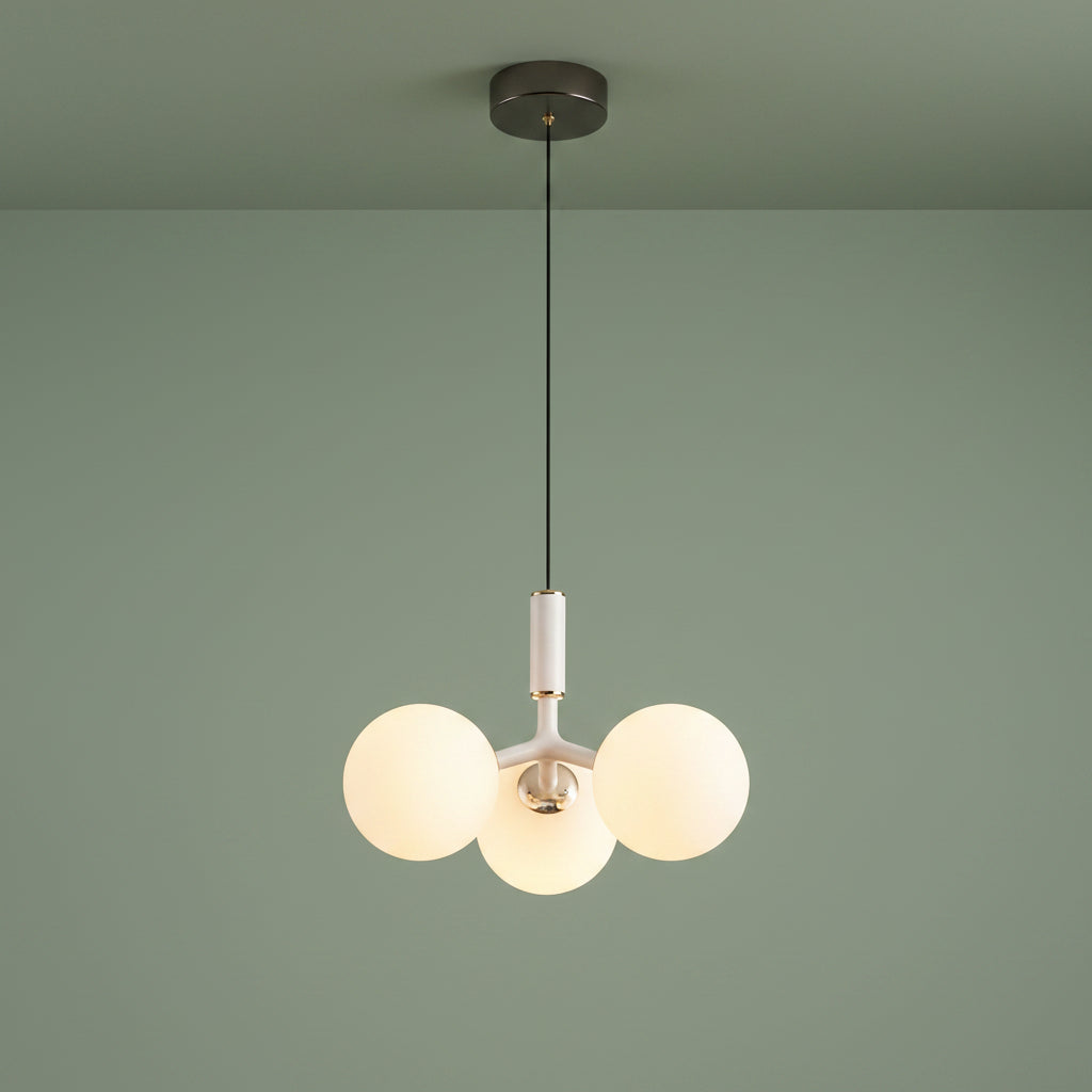 Globe pendant light with three white glass spheres and white central stem, black canopy