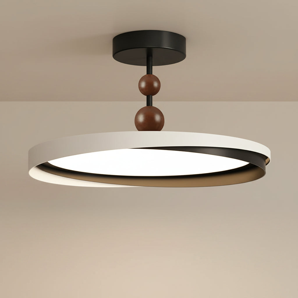Layered geometric ceiling light with black canopy, white ring, and dark brown bulb accents