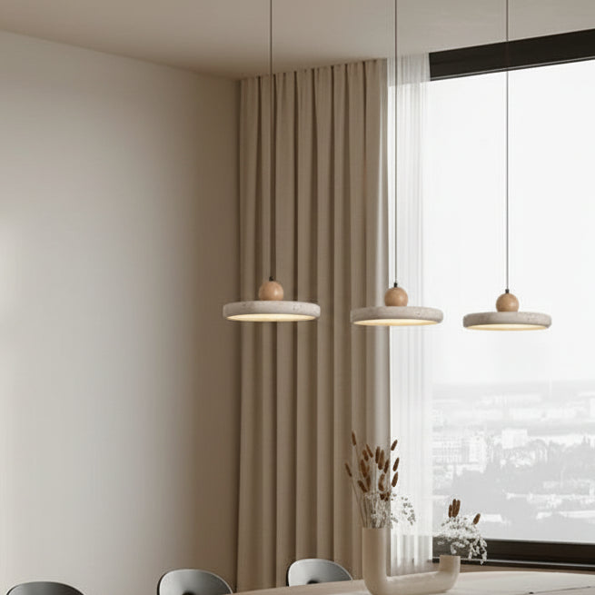 Cluster of three hanging pendant lights with wood spheres and light drum shades