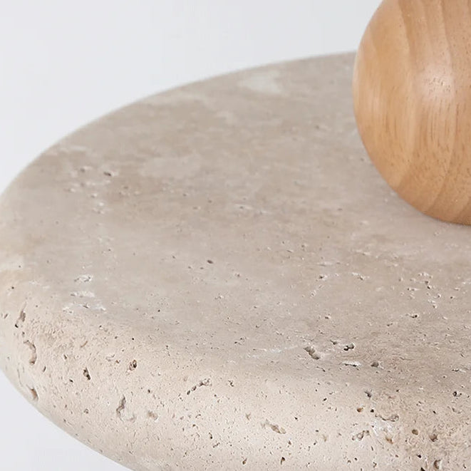 Close-up of travertine pendant shade texture with wood globe top