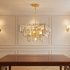 Gold-finish square layered glass chandelier with hanging stem and lit bulbs