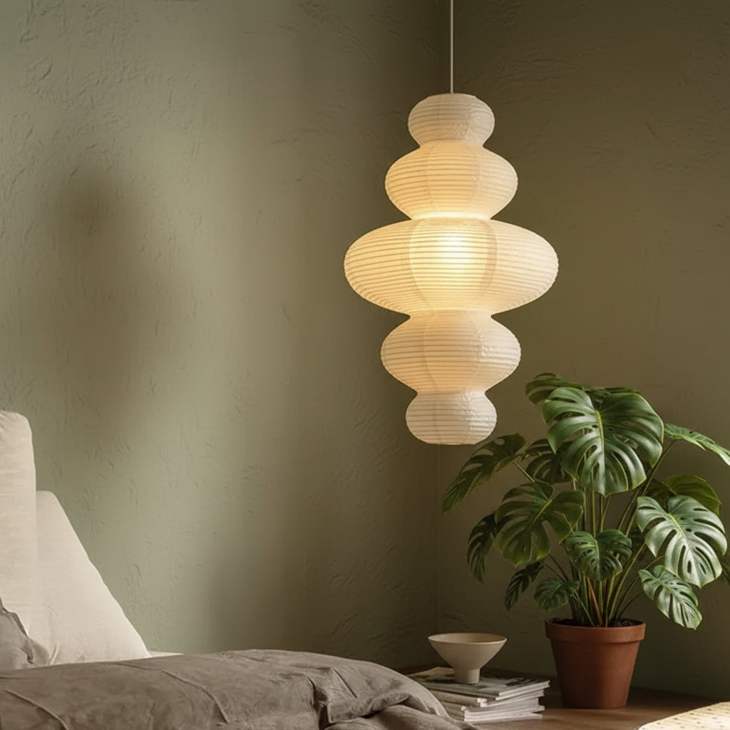 Stacked paper pendant light with multi-tier spherical shades, warm glow