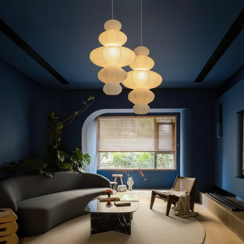 Stacked paper pendant light with multi-tier paper globes hanging over living room