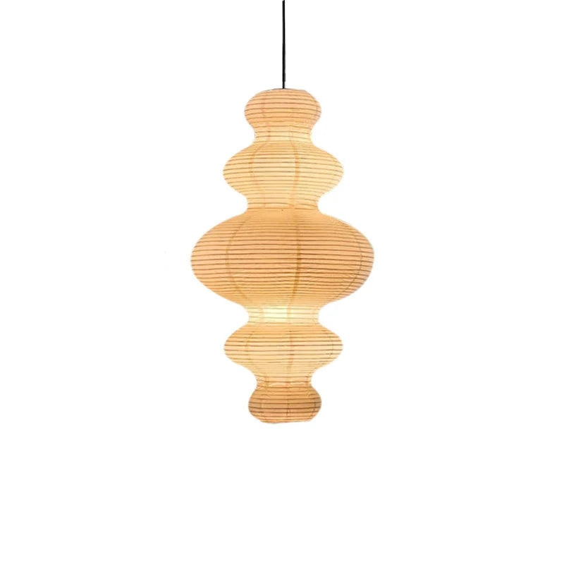 Stacked paper pendant light with layered paper globes, warm amber finish